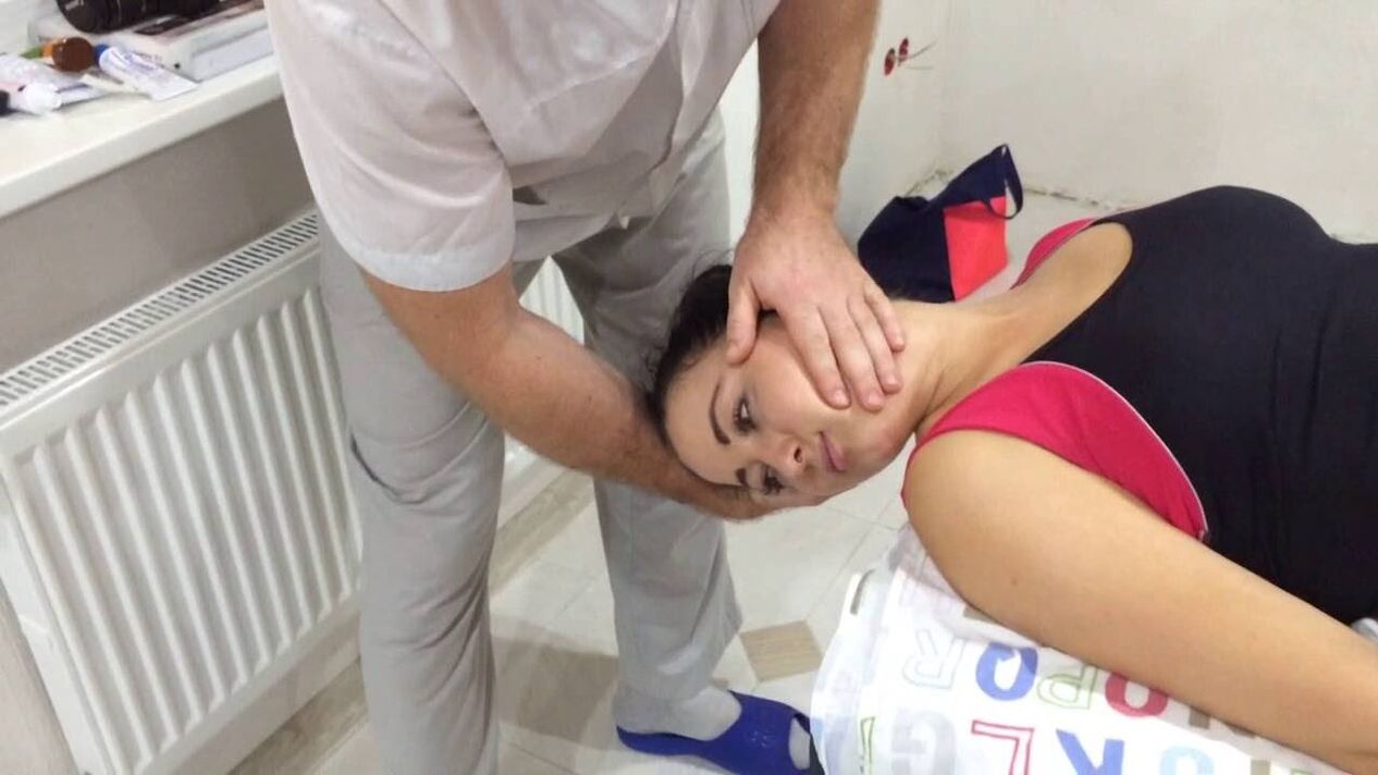 A patient with cervical osteochondrosis shows a manual therapy session